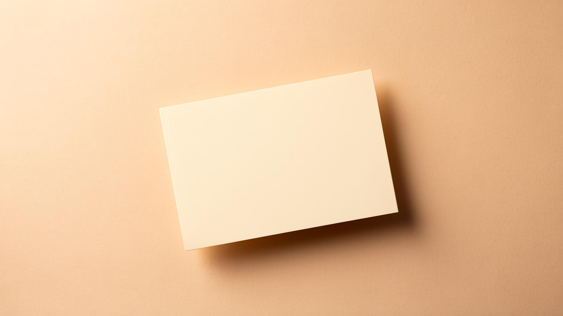 A cream postcard resting on warm paper